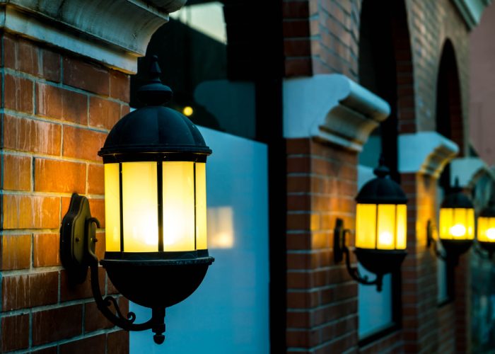 lamp-against-red-brick-wall-night